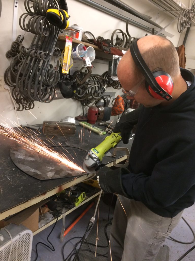 Man grinding metal